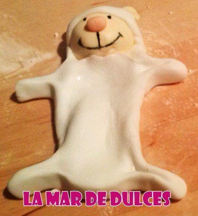 Tarta fondant de niña sentada en la luna